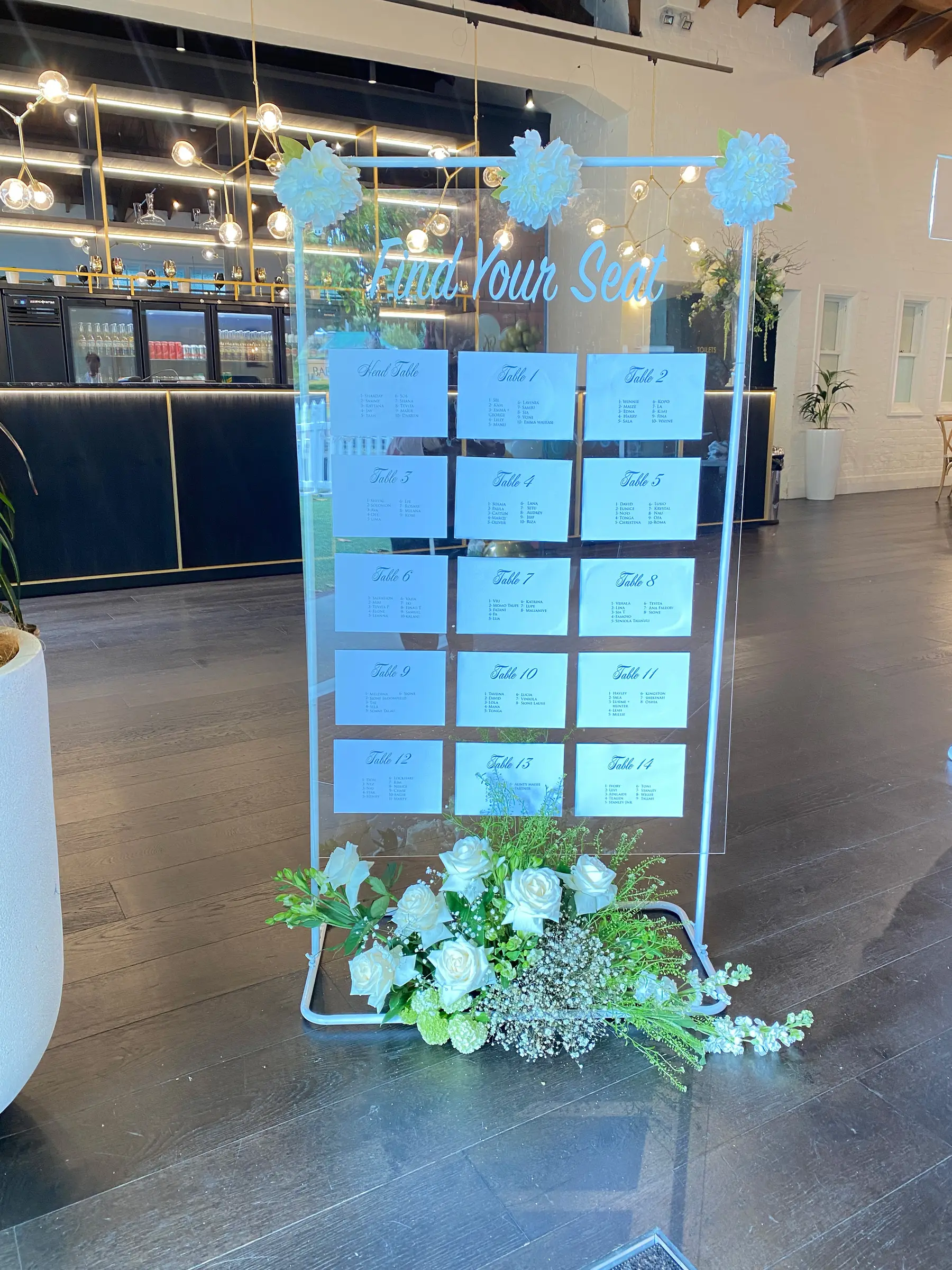 Reception styling by Decoration X: 'Find your seat' seating chart board with florals.
